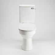 AKW white ergonomic toilet seat with lid closed fitted to a toilet pan