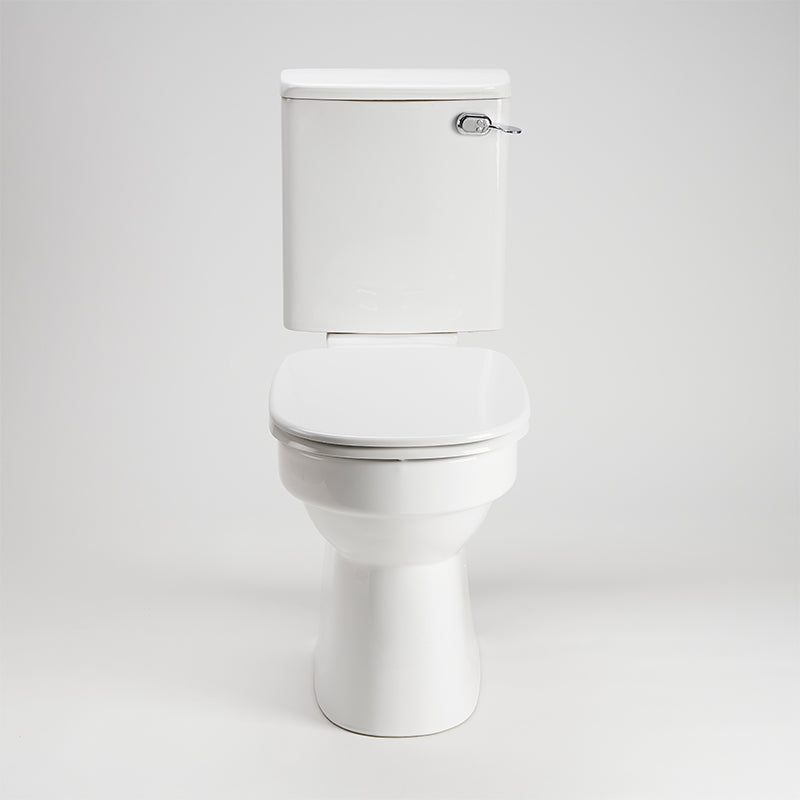 AKW white ergonomic toilet seat with lid closed fitted to a toilet pan
