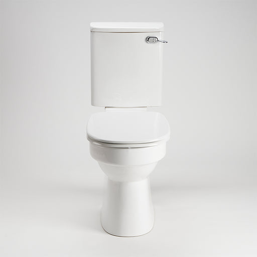 AKW white ergonomic toilet seat with lid closed fitted to a toilet pan