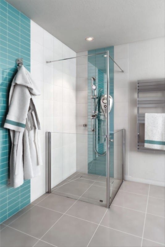 AKW Larenco Care half height glass side panel with floor-to-ceiling support pole in a wet room corner