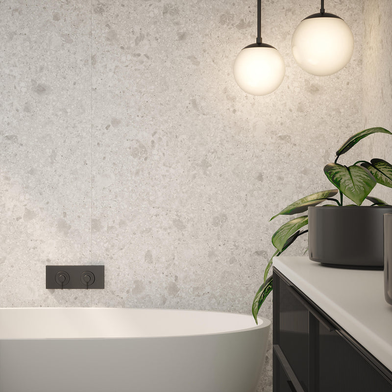 Bushboard Nuance Terrazzo White Shell shower wall panel installed in a bathroom