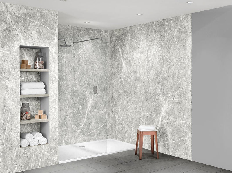 Bushboard Nuance White Lightning Fossil Roccia shower wall panel installed in a bathroom