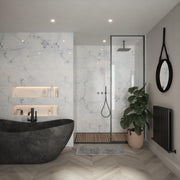 Bushboard Nuance White Onyx Gloss shower wall panel installed in a bathroom