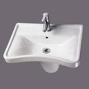 AKW ergonomic concave wash basin 600mm in white vitreous china with concave front edge and pipework shroud