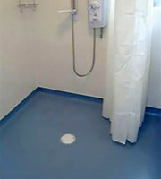 Essential Trade Deck vinyl wet room floor former installed in a level access shower area