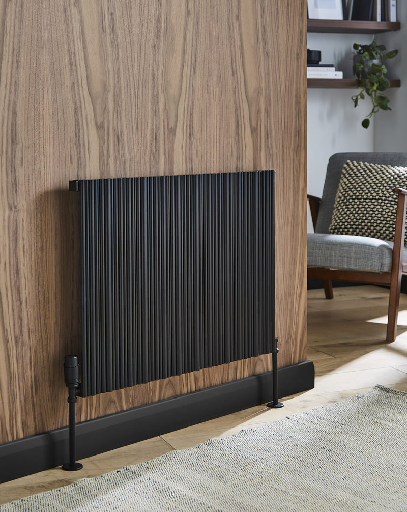Kartell Quebec single horizontal aluminium radiator shown in matt black