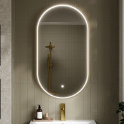 Nuie Columba Brushed Brass LED touch sensor mirror in a modern bathroom