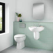 Nuie Ivo round comfort height back to wall toilet pan in a contemporary bathroom