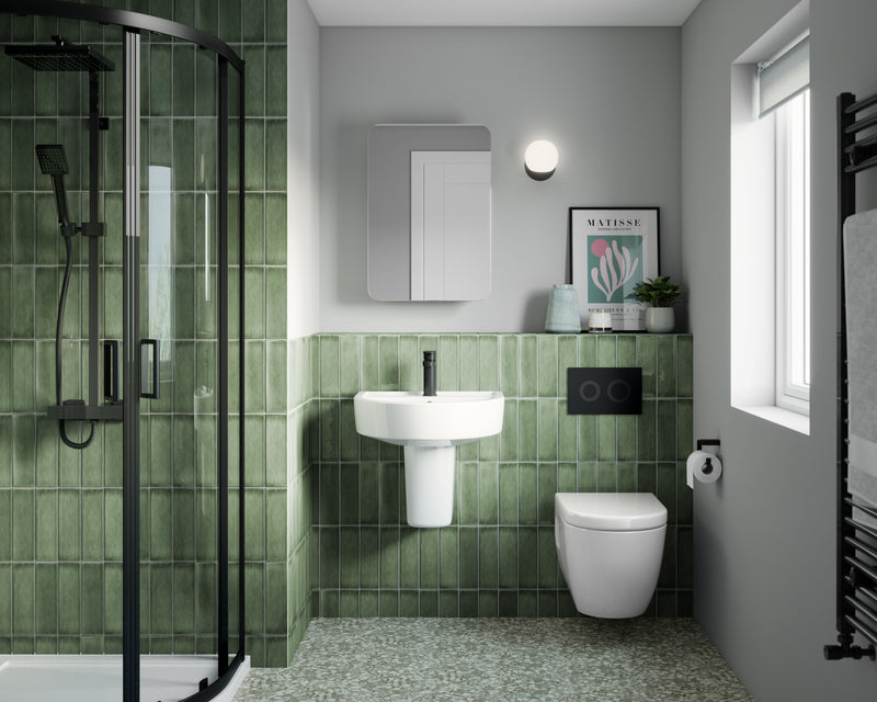 Nuie matt black round dual flush plate fitted in a contemporary bathroom