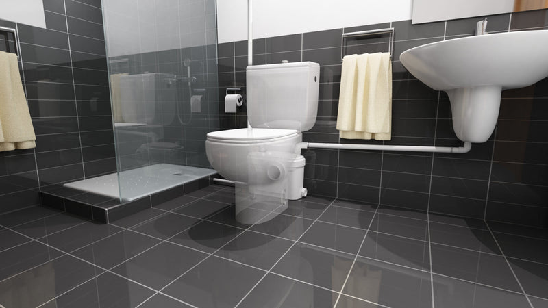 Saniflo Sanisuite macerator pump installed in a bathroom setting