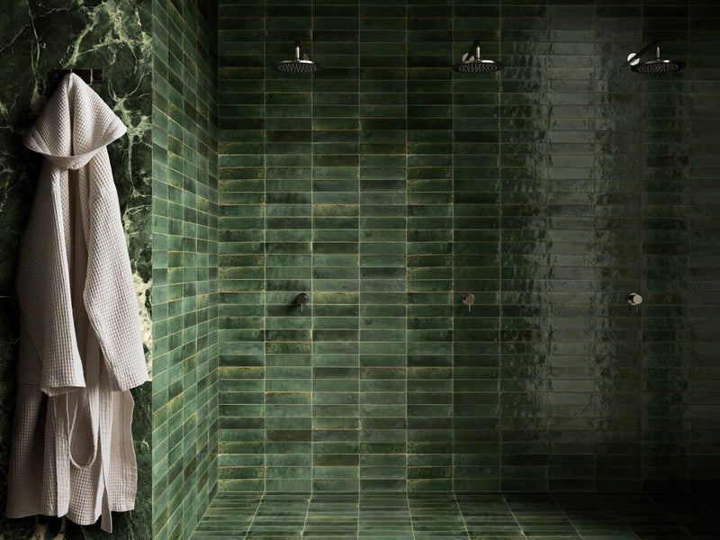 Close-up of Tampa green gloss porcelain brick tile 240x60mm showing glossy textured surface