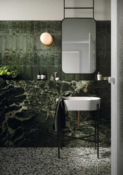 Tampa green gloss porcelain brick tiles 240x60mm laid on a bathroom wall