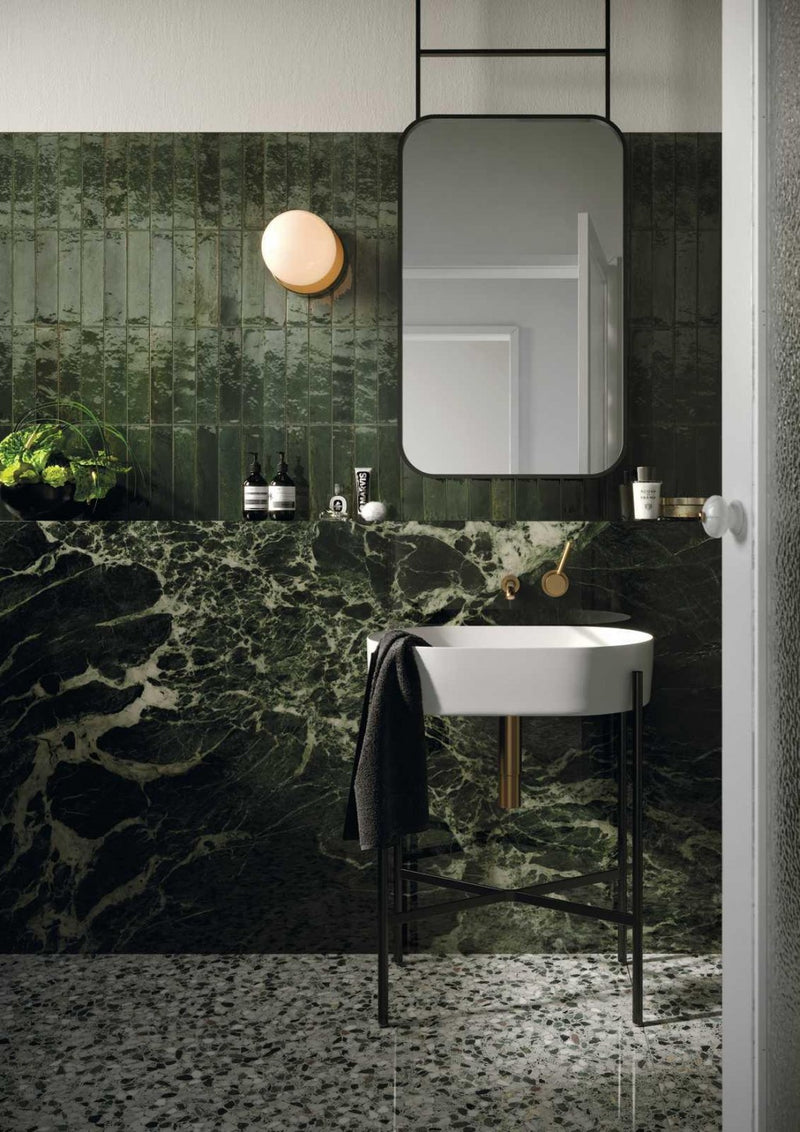 Tampa green gloss porcelain brick tiles 240x60mm laid on a bathroom wall