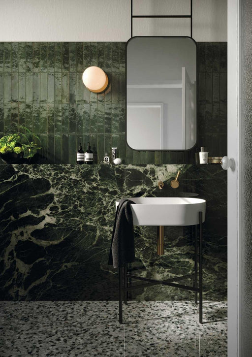 Tampa green gloss porcelain brick tiles 240x60mm laid on a bathroom wall