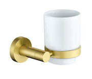 The White Space Capita tumbler and holder in brushed brass